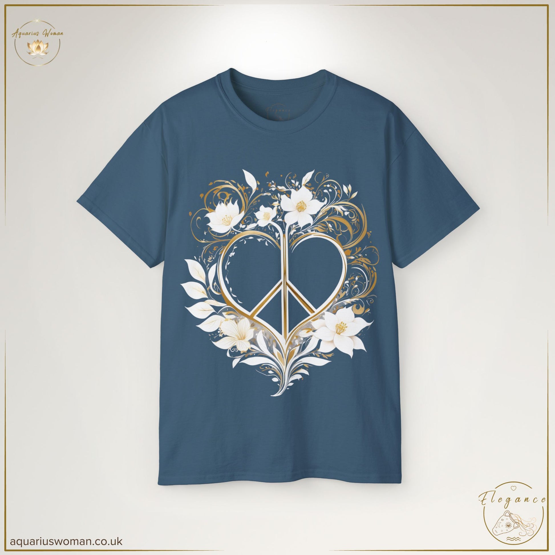 "Peaceful Heart Tee" in Blue Dusk from the Elegance Collection by Aquarius Woman. A soft, elegant t-shirt featuring a golden heart-shaped peace sign surrounded by delicate white floral and leaf details, promoting tranquillity and mindfulness.