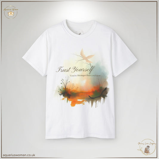 Empowerment Tee – "Trust Yourself, You're Stronger Than You Know" featuring a serene watercolour landscape with warm sunrise hues, a soaring dove symbolising resilience, and an uplifting message of self-trust and strength. Part of the Misery Loves Company Collection by Aquarius Woman, designed for survivors and those embracing new beginnings.