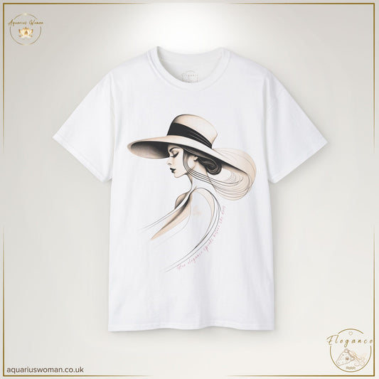 "Grace in Silence - The Elegant Woman Tee" from the Elegance Collection by Aquarius Woman. Features a delicate pencil sketch of a poised woman in a wide-brimmed hat, paired with the quote "Her elegance speaks before she does," symbolising quiet confidence and timeless sophistication.