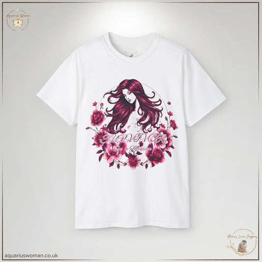 "Survivor on a Mission" Tee in white from the Misery Loves Company Collection by Aquarius Woman. Features an elegant illustration of a woman with flowing hair, surrounded by blooming pink and purple flowers, symbolising healing, empowerment, and transformation.